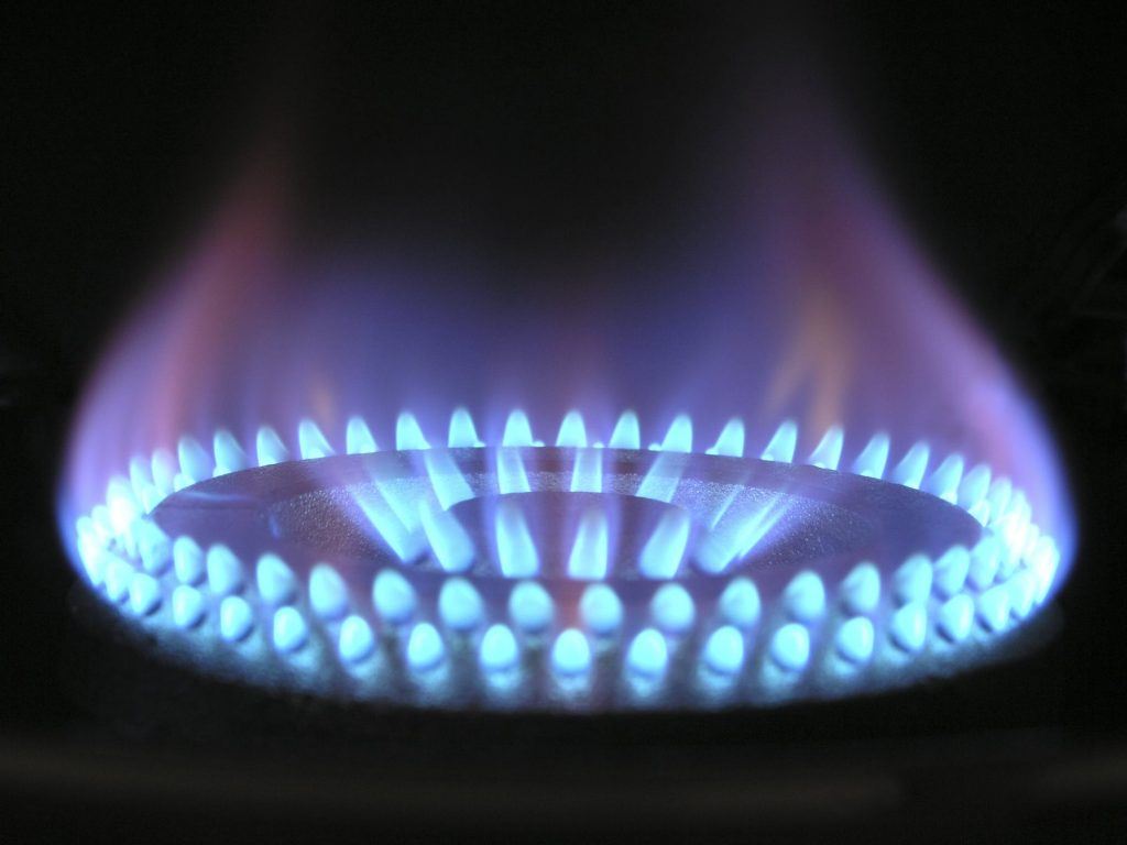 A lit gas stove hob.