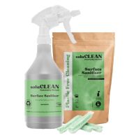 pack of The SoluCLEAN Food Safe Surface Sanitiser Sachets with green label, 4 sachets in front of it and a green label printed trigger spray Bottle4Life